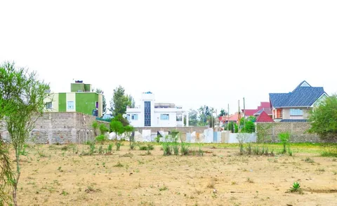 Alma Gardens plot with recently built homes nearby