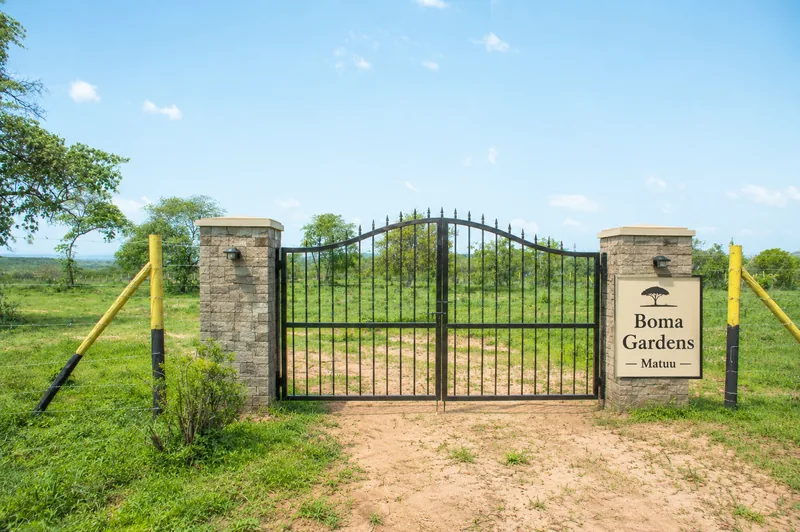 Boma Gardens Matuu entrance gate with stone pillars and signboard