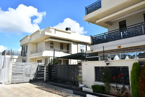 Crimson Bay villas with wrought-iron balconies and paved driveways