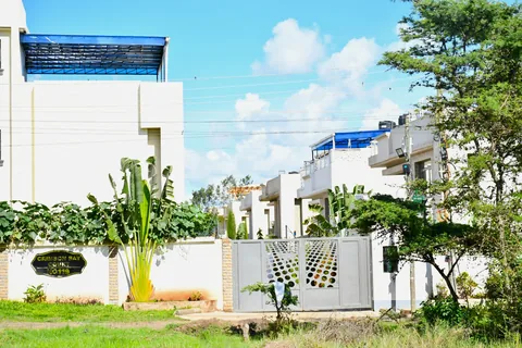 Crimson Bay villa gates and garden walls on a sunny day