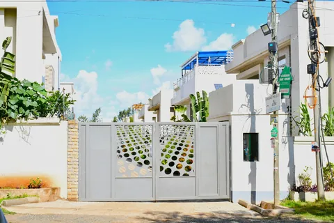 Contemporary Crimson Bay mansionettes behind decorative steel gates