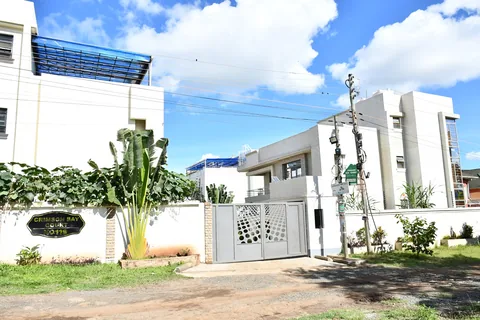 Crimson Bay villa gate and garden wall with tropical plants