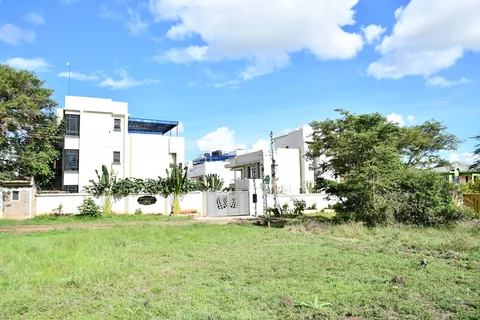 Crimson Bay villas seen across open ground
