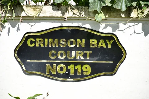 Crimson Bay Court sign at the estate entrance